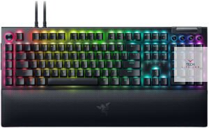 A close-up of a Razer keyboard with RGB backlighting and mechanical keys